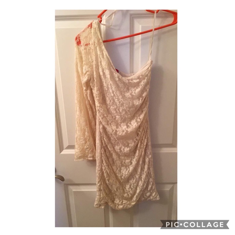 One shoulder white dress.